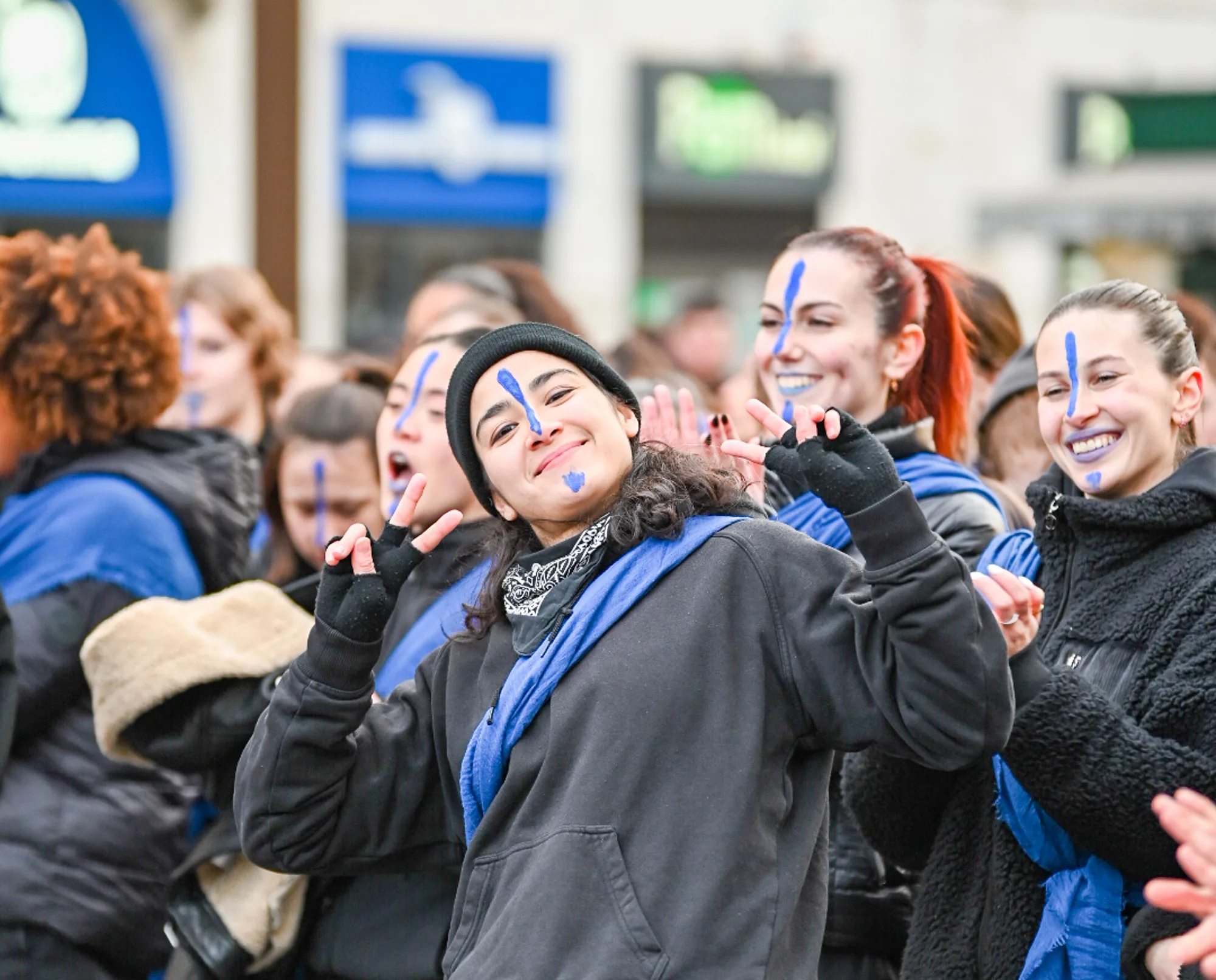 A group of people with their faces painted blue.