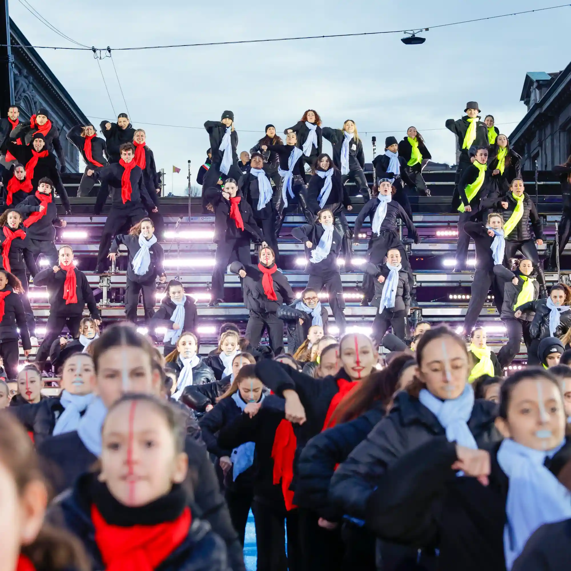 A group of people standing on top of a stage.